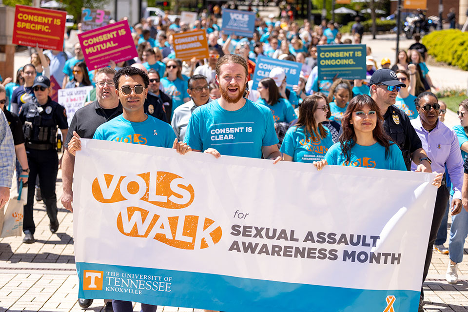 Students and staff walk along Ped Walkway to raise awareness for Sexual Assault Awareness Month (SAAM) hosted by Center for Health Education and Wellness (CHEW), in partnership with the Office of Title IX, on April 16, 2025